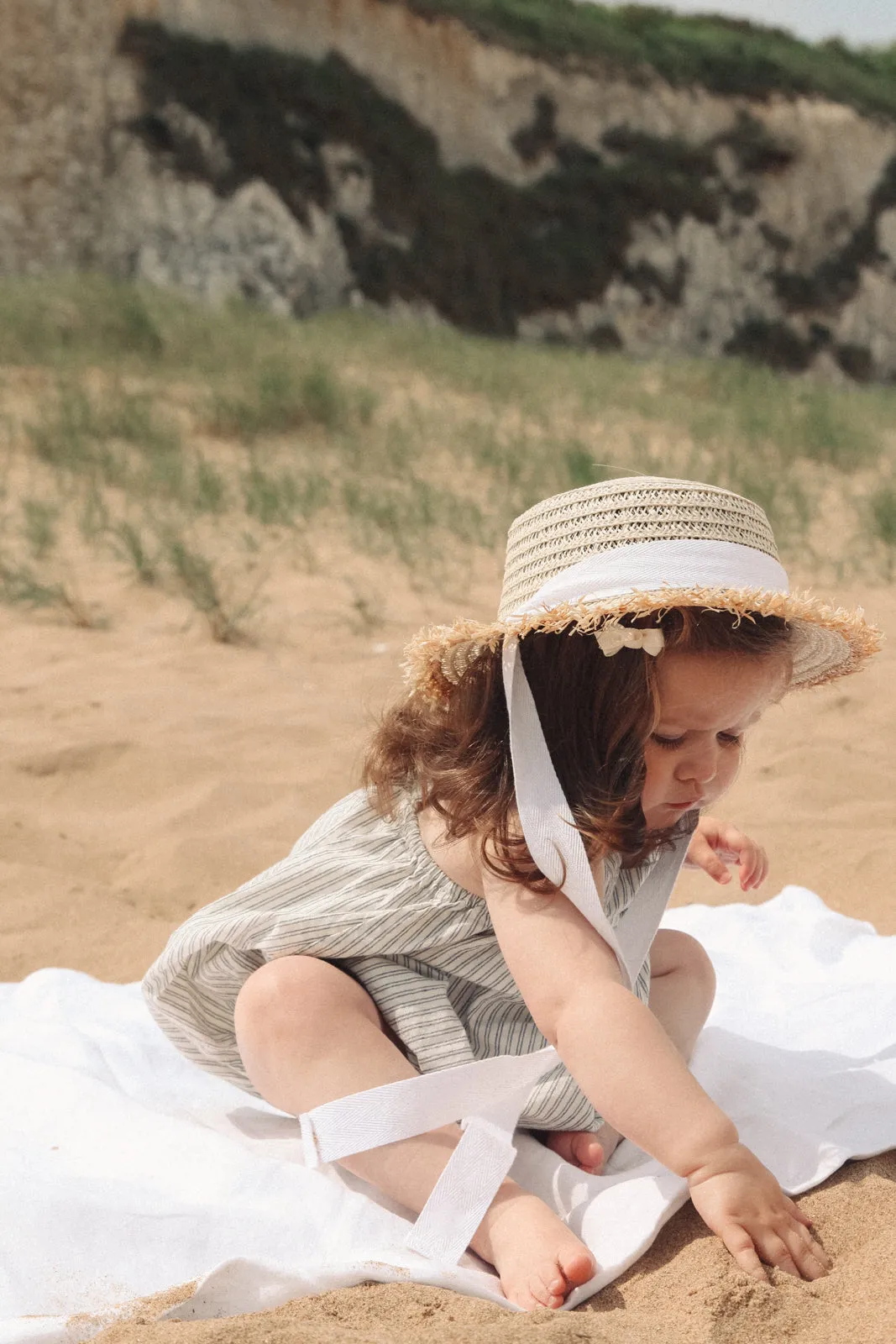 Straw Hat With White Cotton Ties