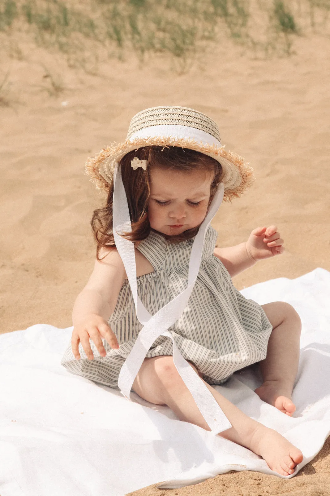 Straw Hat With White Cotton Ties