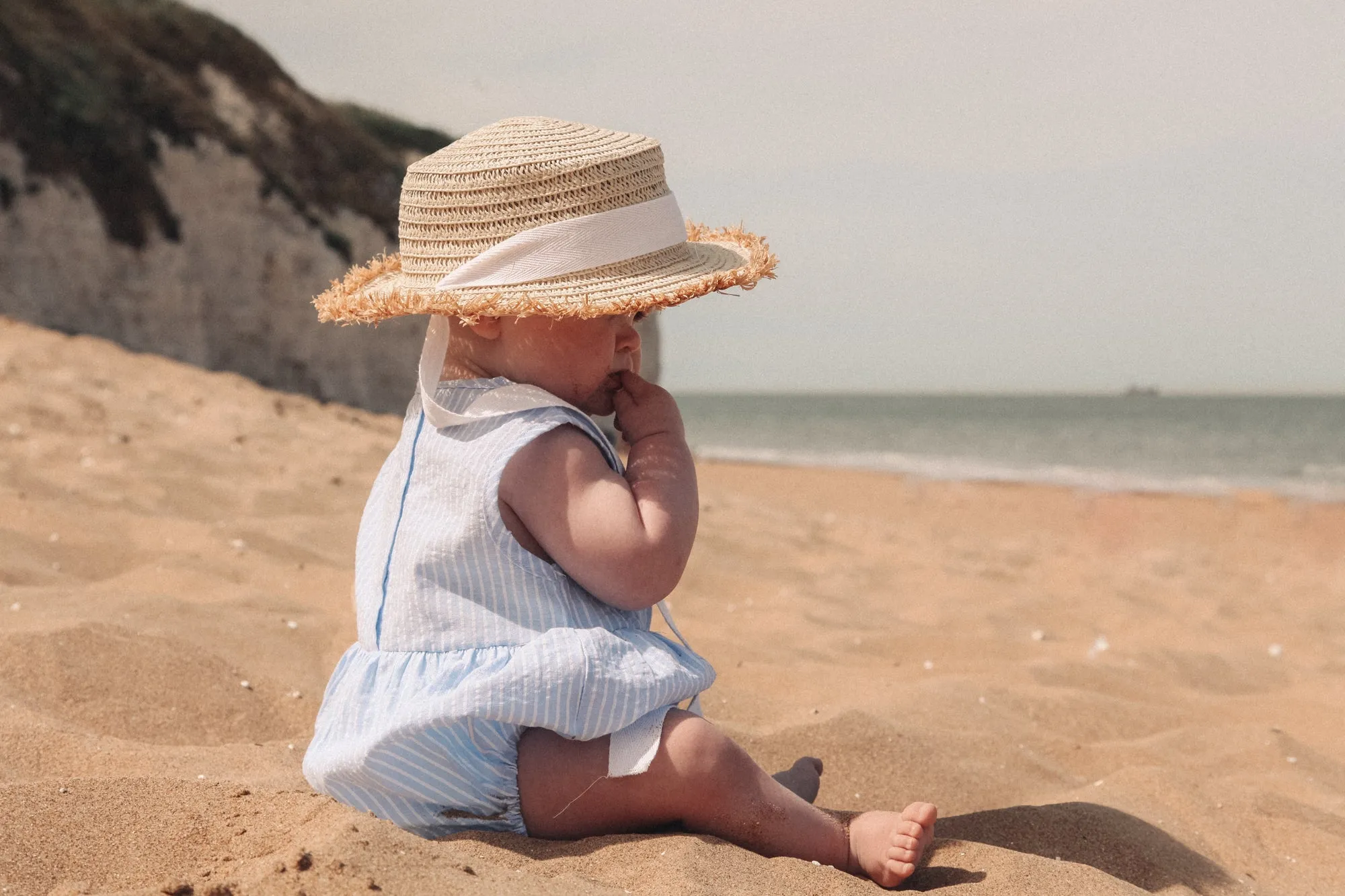 Straw Hat With White Cotton Ties